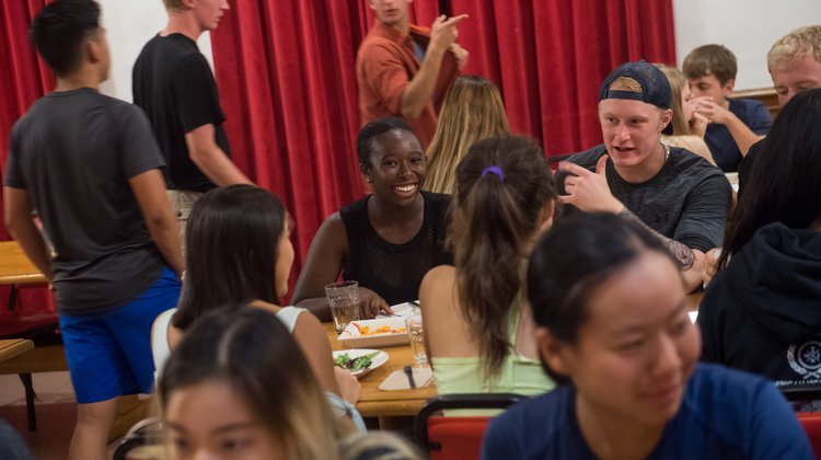 Caltech students enjoy a meal together at Fleming House